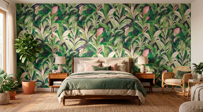 Bedroom with green leafy wallpaper, bed, and furniture.