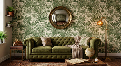 HDWALLS WOODLAND Fern Hemp green toile wallpaper with foxes and balloons behind a green tufted sofa and round mirror.
