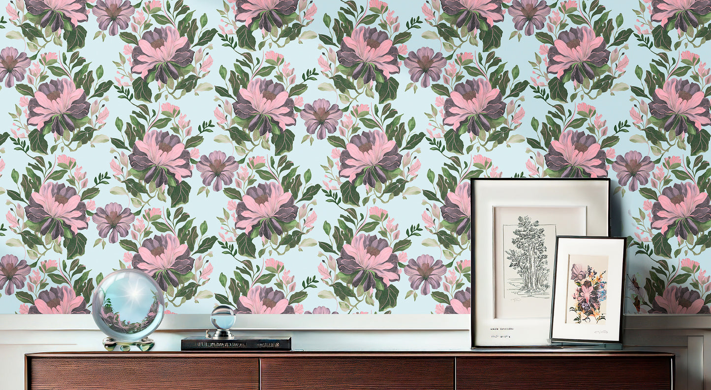 Majestic Dover floral wallpaper featuring large pink and purple peonies with green foliage on a light blue background, styled above a dark wood sideboard.
