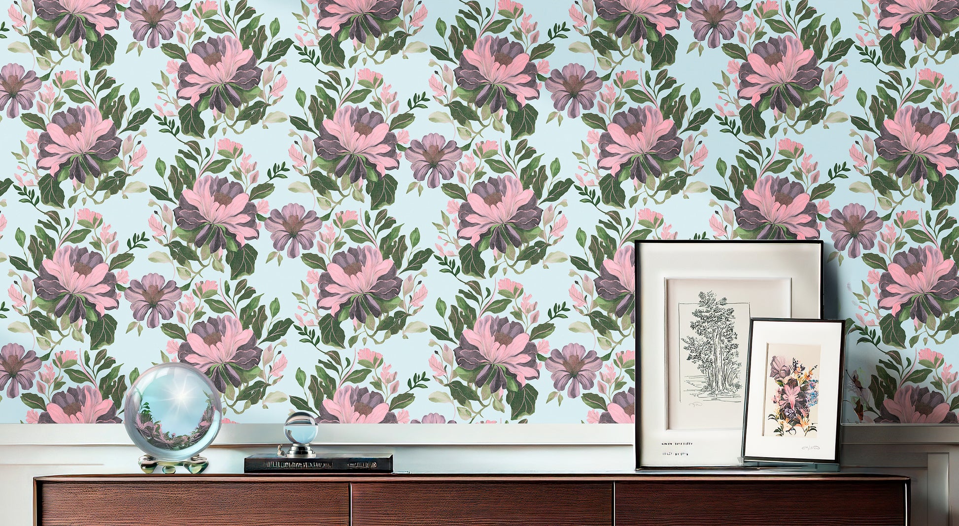 Majestic Dover floral wallpaper featuring large pink and purple peonies with green foliage on a light blue background, styled above a dark wood sideboard.