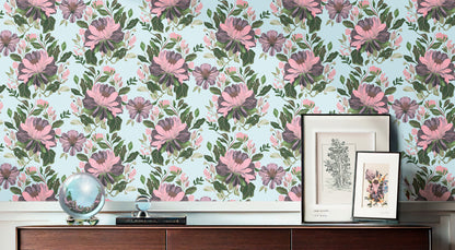 Majestic Dover floral wallpaper featuring large pink and purple peonies with green foliage on a light blue background, styled above a dark wood sideboard.