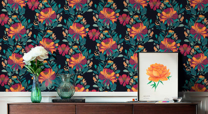 Detailed botanical illustration with a dark, moody aesthetic. The focal points are large, multi-layered flowers with warm golden-orange centers and burgundy outer petals. They are surrounded by lush, teal foliage with subtle highlights of yellow. The overall style is painterly with visible canvas-like texture, creating a sophisticated and high-contrast decorative design.