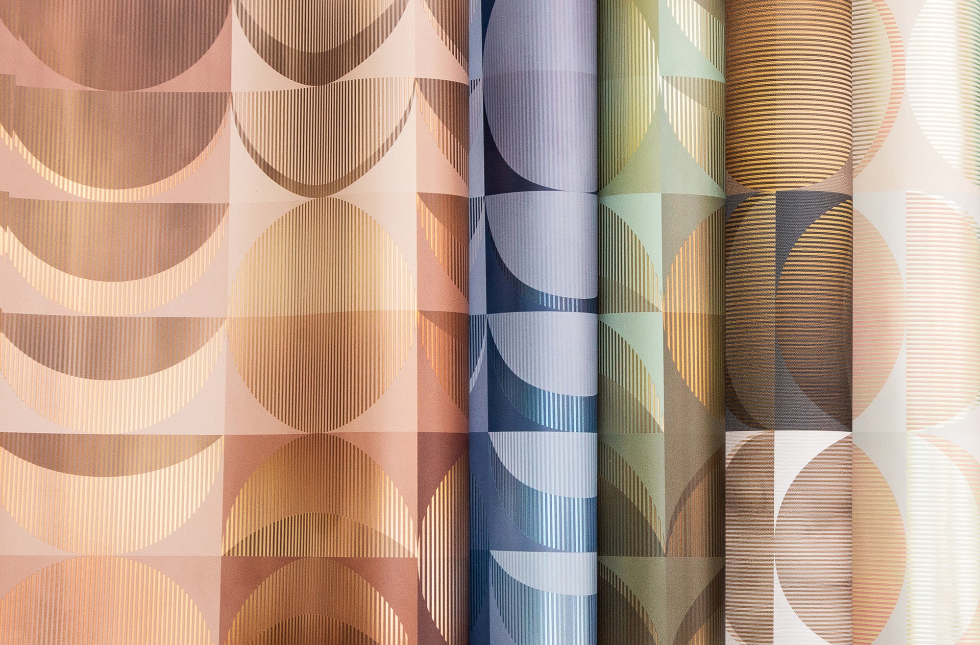 Collection of fabric swatches with geometric patterns in various colors.